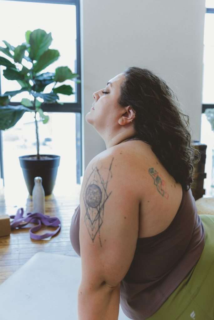 About Flexibility with Vera. Vera is in a cobra pose looking up with eyes closed.